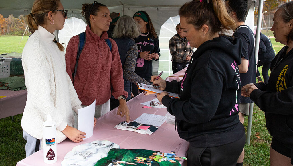 Volunteers at Hot Chili Challenge Check-in Table